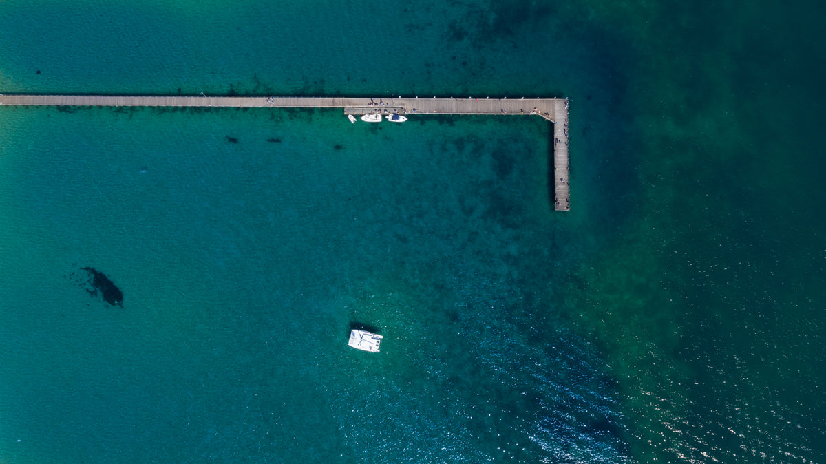 Pier over clear, shallow water
