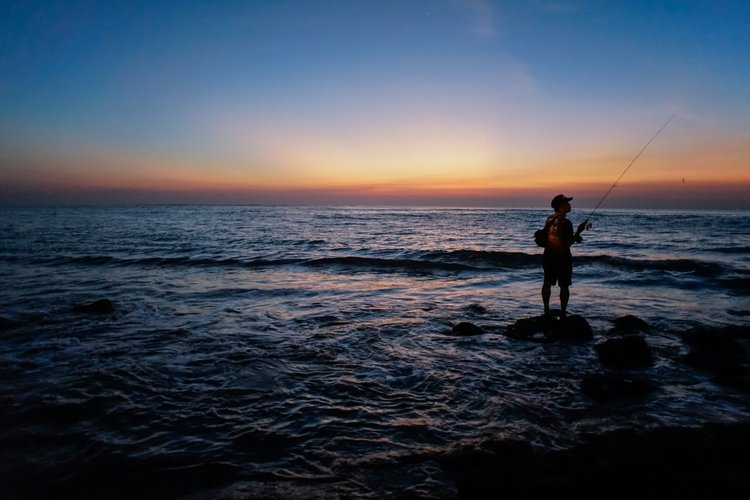 Squid fishing at dusk